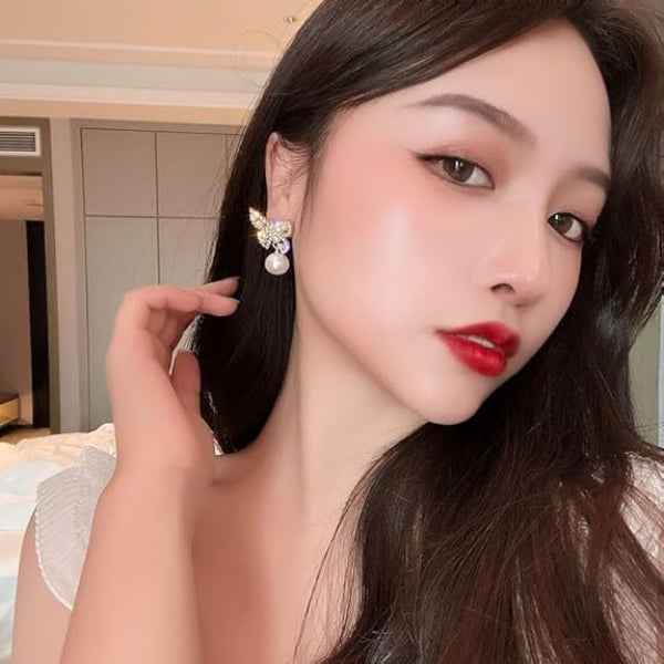 Butterfly Pearl Earrings: Gold Crystal Studs for a Polished Look