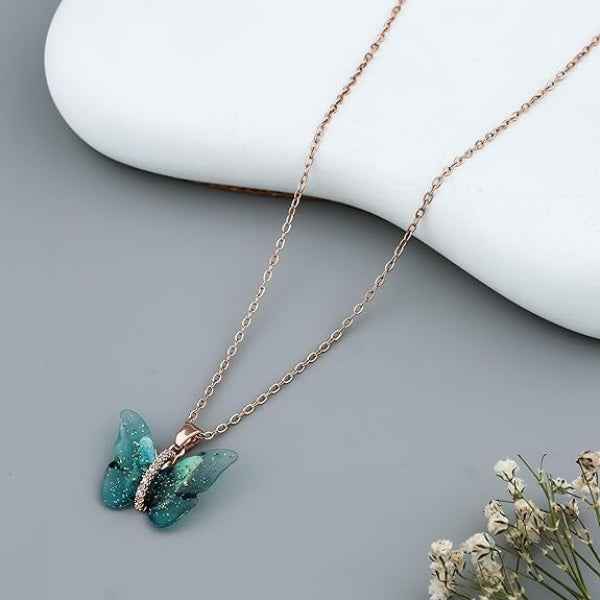 Ethereal Butterfly Resin Necklace – Rose Gold & Glittering Blue