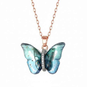 Ethereal Butterfly Resin Necklace – Rose Gold & Glittering Blue