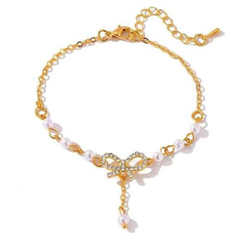 Radiant Gold Bow Pearl Dangle Bracelet | Polished Rhinestone Jewelry