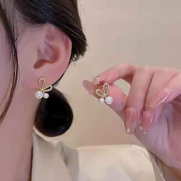 Dainty Gold Bow Pearl Stud Earrings – Elegant & Playful Design