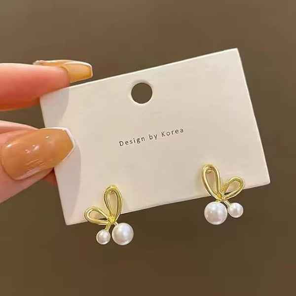 Dainty Gold Bow Pearl Stud Earrings – Elegant & Playful Design