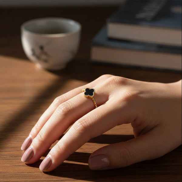 Stunning Gold Clover Ring with a Twisted Band and Black Quatrefoil