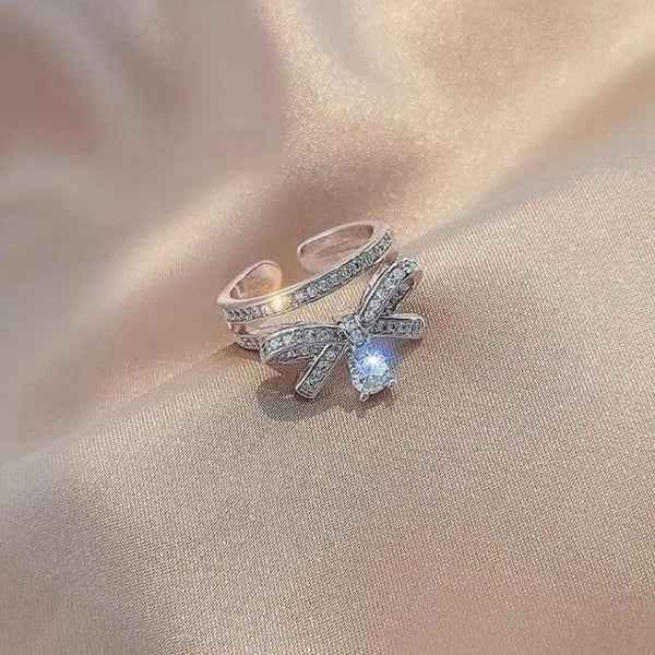 Silver Bow Ring: Dangle Charm Ring with Sparkling CZ Crystal Band