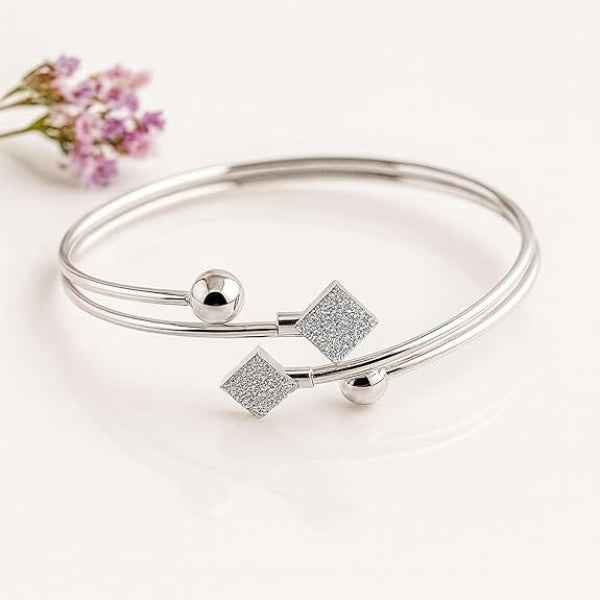 Silver Bypass Bangle with Glittering Rhombus charms and Ball Accents