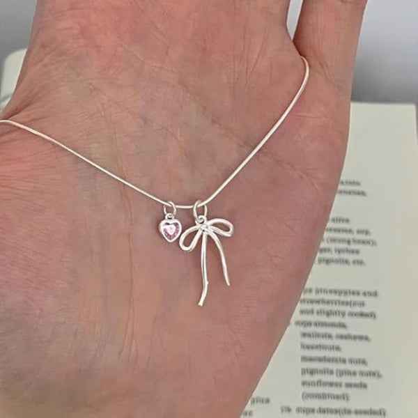 Silver Heart Necklace with Pink Crystal Charm and Dainty Bow Pendant